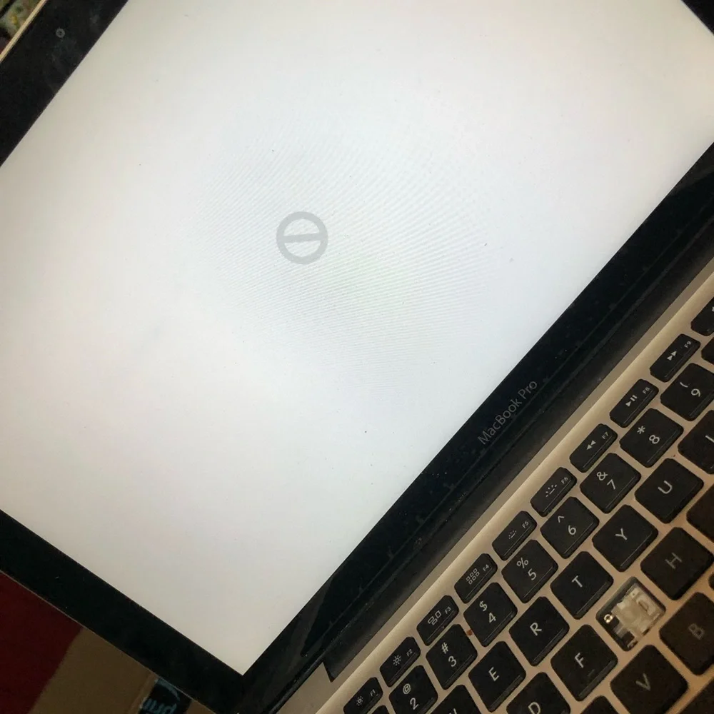 Apple MacBook with 4 chargers and dell laptop for parts